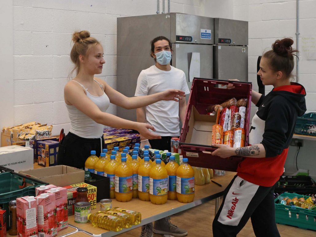 Help the Hungry: Teenage volunteers pitch in to sort goods for some of London’s poorest families